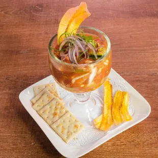 Coctel de Camaron- Shrimp cocktail with pico de gallo, cilantro, avocado, cucumber, and crackers.