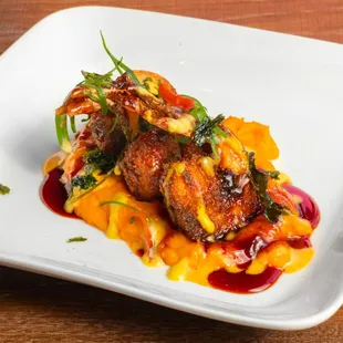 Camaron Crocante- Mashed sweet potato, sangria reduction sauce, and 3 lightly breaded fried shrimp.