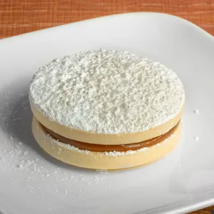 Alfajor- Two melt-in-your mouth cookies made from scratch sandwiched together with dulce de leche.
