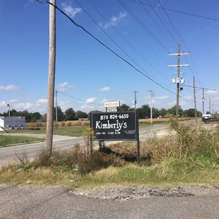 a sign on a rural road