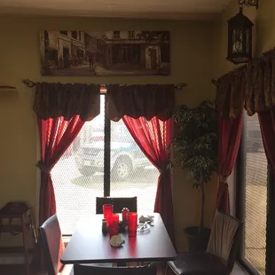 a dining room with a table and chairs