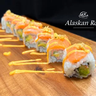 Crab salad, cucumber, avocado, topped with fresh salmon, mango pico de gallo and spicy mayo