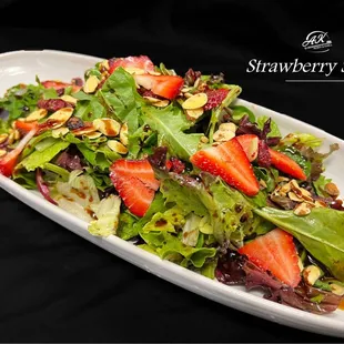 Mixed greens, strawberries, candied almonds, craisins, Balsamic dressing