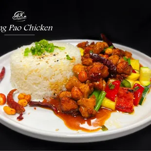 Fried chicken, onions, peppers, peanuts, Kung Pao sauce, with a side of white rice &amp; seasonal vegetables