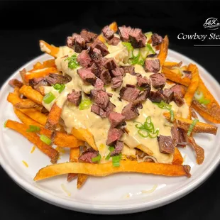 Seasoned fries topped with cowboy queso &amp; Angus steak