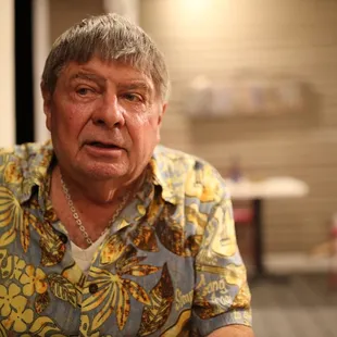 a man in a hawaiian shirt