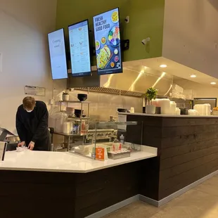 a man preparing food in a kitchen