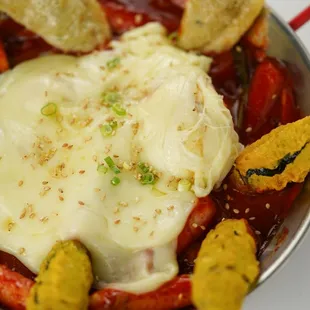 a bowl of kimchi with a fried egg on top