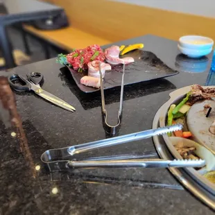 a plate of food and utensils