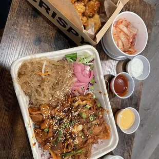 Spicy pork box, popcorn chicken and kimchi plus sauces