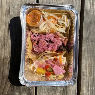 Kimchi Taco 3 DEAL - top to bottom: Spicy Grilled Chicken Taco, Korean BBQ Beef Short Rib Kimchi Taco, Krispy Fish Kimchi Taco.