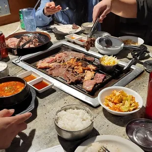 A mix of Korean BBQ sizzling making our mouths water as we watch the grilling. Everything they serve is edible and very  Delicious.