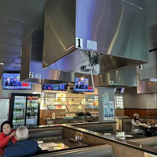 a woman sitting in a booth