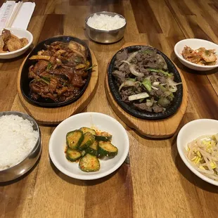 Left- spicy bulgogi (#11) Right- bulgogi (#12) Sides- rice, spicy cucumbers, bean sprouts, kimchi, fish cake