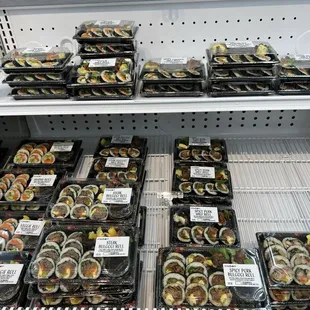 a display of various types of sushi