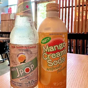 two bottles of mango cream soda