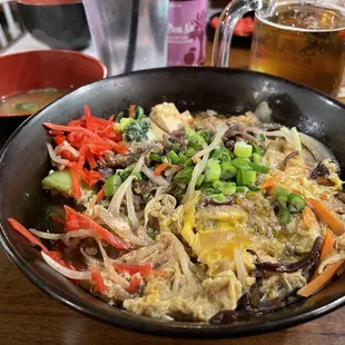 Sukiyakidon. Flavor is nice, but way too much sauce. Looks more like salty soupy rice underneath.