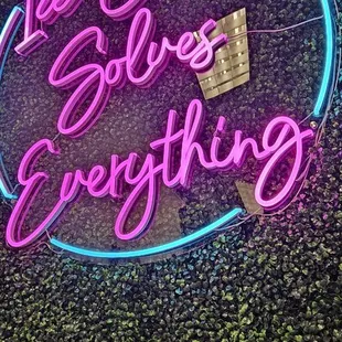 a neon sign that says ice cream goes everything