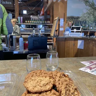 a plate of cookies and wine glasses