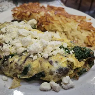 Bacon, spinach, mushroom and feta omelet - a generous potion! Definitely shareable!