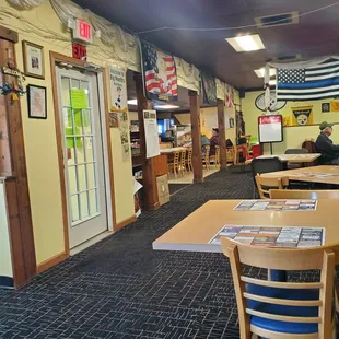 a dining area with tables and chairs