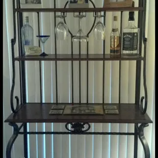 a shelf with wine glasses on it