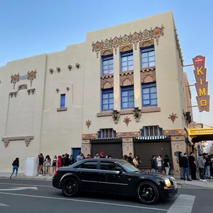 a black car parked in front of it