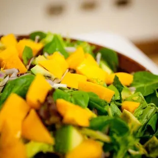 Mediterranean mango Salad with Lilikoi Balsamic Vinaigrette.