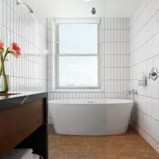 Guestroom Suites feature large soaking tubs and large living room space.