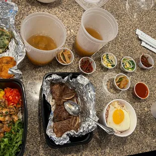 Cockle bibimbap, beef short rib, soups, and extras