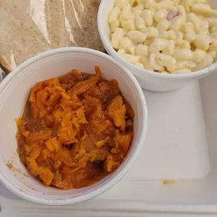 Sweet candied yams, macaroni salad and you can&apos;t forget some slices of bread that go perfect with this meal.