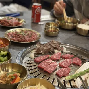 a man sitting at a table with a lot of food