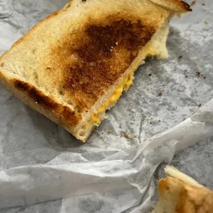 Grilled Cheese on sourdough two types of cheese.