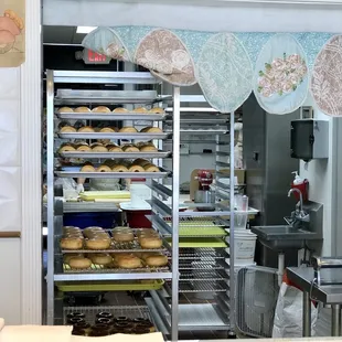 a baker's kitchen with lots of doughnuts