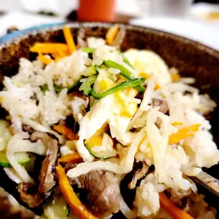 a bowl of rice and vegetables