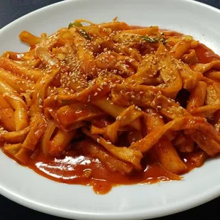 a plate of noodles and sauce