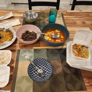 Seafood pancakes, bulgogi, tofu soup, banchan.