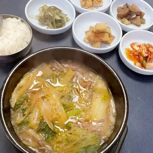 Beef and vegetable soup with sides and rice
