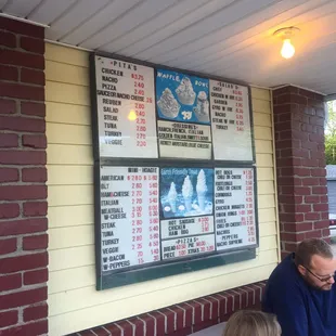 a man and a little girl eating ice cream cones