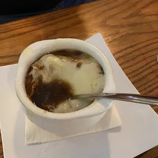 Lackluster cheese topping on French onion soup.