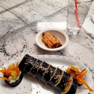 Kimbap with no meat and not much in traditional flavor, kimchee was good.