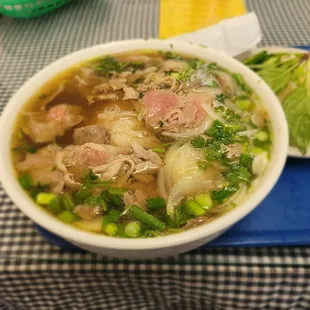 a bowl of soup on a tray