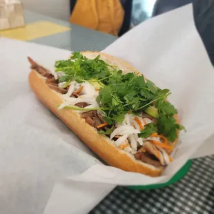 a sandwich with meat and vegetables