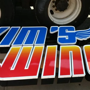 a close up of the wing logo