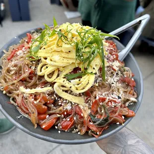 a plate of noodles and vegetables