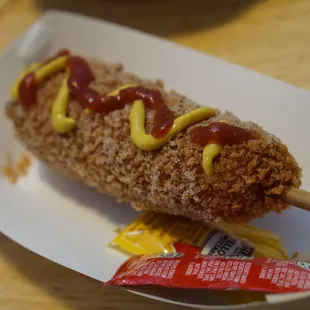 a hot dog with mustard and ketchup