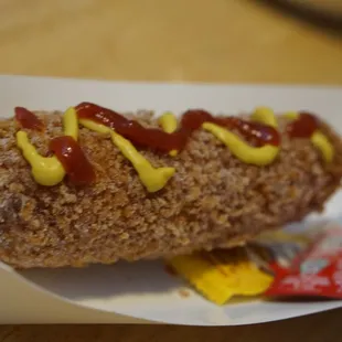 a hot dog with mustard and ketchup