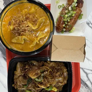 Lao sausage, yellow curry, and drunken noodles (pad kee mow)