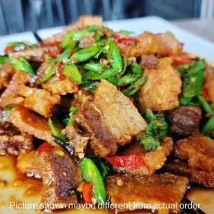 a plate of stir fried meat