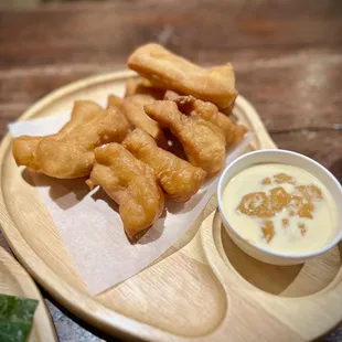 Pa Tong Go : Thai-style airy and crispy fried dough with a side of Thai tea custard dipping